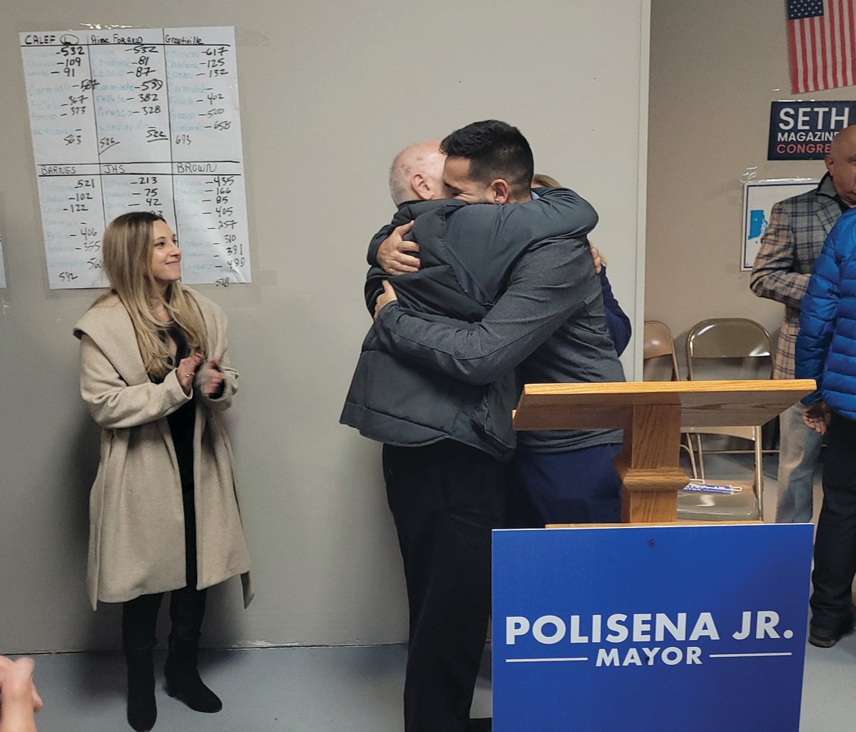 MAYOR ELECT: Mayor-elect Joe Polisena Jr. hugs his father, current Johnston Mayor Joseph Polisena, after Tuesday night’s victory was clear.
